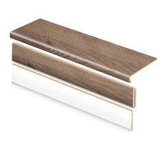 the side profile of a wood and white skirting board with an arrow pointing up at it