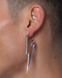 Powerfully electric. This thrilling statement earring will make you the brightest in the room. Each line of the lightning bolt is artfully extruded to perfection, surely to be your new favorite piece. Made of hypoallergenic stainless steel available in a silver or gold finish. Engineered with designer and skin safe sensibility. Ships in RARE-ROMANCE ™ branded packaging, perfect for gifts. Select your style | select your color | Add to cart | Ships same day of purchase PRODUCT SPECIFICATIONSLENTH Lightning Jewelry, Lightning Accessories, Asymetrical Earrings, Electric Blue Eyes, Lightning Earrings, Staple Earrings, Spike Hoop Earrings, Frankie Stein, Lightning Bolt Earrings