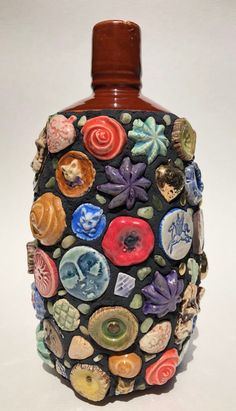 a bottle with many different designs on it