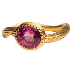 A 22K gold ring with textured tooling featuring a round, brilliant cut pink tourmaline in a bezel setting. Gold band has a subtle serpentine shape to it. The fine jewelry collection is sourced, designed or created by Deborah Lockhart Phillips. Through her international travels, she has cultivated prime resources for fine precious and semi-precious gemstones of unusual cuts in a variety of settings. Included in the collection are antique, high 22K gold pieces with intricate workmanship rarely fou 22k Gold Ring, Pink Tourmaline Ring, Gold And Pink, Tourmaline Ring, Fine Jewelry Collection, Precious Gemstones, Nantucket, 22k Gold, Gold Band