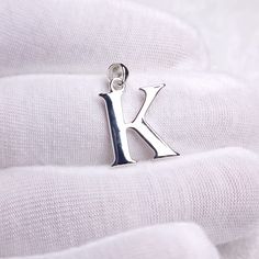 Initial necklace, Alphabet K initial pendant. This pendant is absolutely handmade and made of 925 sterling silver (GUARANTEED) Gemlogica is an American business and our motive is to create an honest and transparent company. We do not misrepresent our items and we strictly use ethically mined NATURAL gemstones and precious metals like sterling silver and gold. (we do not use brass, copper, zinc alloy, or any other base metals) ♥ Metal Type - Sterling silver (92.5% pure silver) ♥ Alphabet - A pend Silver Initial Pendant Necklace, Silver Initial Pendant Necklace As A Gift, Silver Initial Necklace In Sterling Silver, Silver Initial Pendant Necklace With Charms, Silver Initial Necklace With Pendant Charms, Silver Pendant Initial Necklace With Charms, Silver Initial Pendant Necklace Gift, Sterling Silver Pendant Initial Necklace, Handmade Initial Pendant Necklace