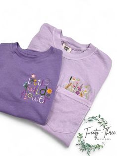 Match your mini with these Little Wild flower embroidered kid shirts! These embroidered floral pocket tees make the perfect Spring/Summer shirts! Check out our page for these shirts in more colors! if you don't see a color you want please message and we can discuss other options.  ** All adult colors of shirts are Comfort Color Brand besides Mustard- is ComfortWash ** **Kid shirts are Rabit Skins Brand** **shirt colors may vary slightly from shirt to shirt depending on dye. please use the color Cute Crew Neck Top With Pockets, Casual Tops With Multicolor Floral Applique, Casual Tops With Multicolor Floral Embroidery, Cute Embroidered T-shirt For Spring, Cute Spring Tops With Pockets, Purple Cotton Tops With Embroidered Text, Purple Short Sleeve Tops With Pockets, Cute Letter Embroidery T-shirt For Spring, Casual T-shirt With Multicolor Letter Embroidery