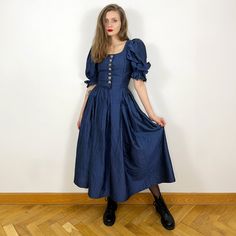 - Stunning vintage Austrian dirndl silk dress - 100% silk - Metal heart shaped buttons - Very good condition - Tag size 34, fits XS-S, please see measurements Measurements (laying flat): Shoulders: 31 cm / 12.2 inches Armpit to armpit: 35 cm / 13.8 inches Waist: 31 cm / 12.2 inches Length: 127 cm / 50 inches SHIPPING INFO: Shipping price in the listing is for the "Standard Latvian post shipping". Includes tracking info and takes: * 5-7 business days within European Union * 10-15 business days to Dark Cottagecore Dress, Navy Blue Silk Dress, Blue Silk Dress, Dark Cottagecore, Cottagecore Dress, Prairie Dress, Metal Heart, Blue Silk, Dress 100