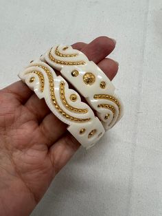 Handmade Traditional Bengali Sankha Bangles Set. Material : Plastic (Imitation not real Gold). Size: 2.4 Please note : Handmade jewelry have some imperfections in designs. However, it does not affect the overall look of the jewelry.   Please contact for any question before purchase Handmade White Temple Jewelry, White Spiritual Bangle Jewelry, White Spiritual Festive Jewelry, Traditional White Bracelets For Puja, White Bracelets For Puja And Festivals, White Bangle Jewelry For Festive Occasions, Carved White Bracelet Jewelry, Handmade White Bangle For Wedding, White Carved Bracelet Jewelry