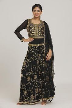 Black kurta with floral embroidery and tassels. Paired with flared pant and dupatta.
Components: 3
Pattern: Embroidered
Type Of Work: Floral
Neckline: Round
Sleeve Type: Full
Color: Black
Other Details: 
Curved hem
Tassels
Occasion: Mehendi and Haldi - Aza Fashions Embroidered Semi-stitched Sharara In Maxi Length, Floor-length Sets With Resham Embroidery For Festive Occasions, Bollywood Style Maxi Length Sharara With Intricate Embroidery, Bollywood Style Party Palazzo Set With Intricate Embroidery, Floor-length Festive Sets With Resham Embroidery, Festive Floor-length Sets With Resham Embroidery, Festive Party Palazzo Set With Intricate Embroidery, Festive Floral Embroidered Saree Set, Floral Embroidered Party Sets For Transitional Seasons