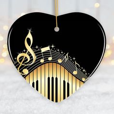 a heart shaped ornament with musical notes