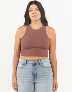 High Neck Tank. Solid Cotton Blend Tank Top With Stretch. Ribbed Knit Construction. High Neckline. Sleeveless. Fitted, Crop Silhouette. 57% Cotton/38% Polyester/5% Spandex. Hand Wash. Imported. Model Is Wearing A Size Large. Model Measurements:height: 5'7" Bust: 38"waist: 32"hips: 42" | Full Tilt High Neck Tank Sleeveless Elastane Crop Top With Seamless Construction, Casual Seamless Elastane Tank Top, Ribbed Sleeveless Top With Medium Support, Ribbed Sleeveless Elastane Crop Top, Sleeveless Ribbed Elastane Crop Top, Versatile Sleeveless Elastane Crop Top, Brown Stretch Athleisure Top, Brown Stretch Sleeveless Crop Top, Brown Sleeveless Workout Top