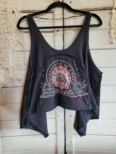 "Free People black tank top, size small.  Uniquely upcycled using vintage t-shirt graphics and fabrics.  All sewing is done by hand including embroidery.  Although marked as a \"small\", typical of Free People brand, this tank top is very roomy.  Chest actually measures 26\" across, neck to hem in center front measures approximately 11\" at shortest point." Tank Upcycle, Black Warrior, Upcycled Jackets, Shirt Graphics, Denim Flowers, People Brand, Shirts Vintage, Green Polka Dot, Black Tank Top