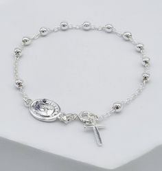 "Catholic Sterling Silver Rosary Beads Cross Bracelet. This rosary has a decade of beads and a dangling cross charm. size of beads:4mm bracelet length: 19 cm (7,5\") Check out our other items in Boutique Medjugorje store: https://boutiquemedjugorje.etsy.com" Silver Rosary, Rosary Bracelet, Beaded Cross, Rosary Beads, Bracelet Sterling Silver, Cross Bracelet, Cross Charms, Virgin Mary, Adjustable Bracelet