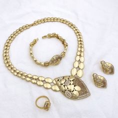 Afraic Jewelry -Jewelry Sets For Women Italian 18k Gold Plated Jewelry Rhinestone Necklace Sets Wedding Party Gift product name: Latest jewelry set designs for women material: zinc alloy keyword: Dubai Gold Color Fashion Jewelry Style: Latest jewelry set for women Style: TRENDY Shape\pattern: Flower Plating color: Gold Plating Origin: Mainland China Occasion: wedding Model Number: 215 Metals Type: Zinc alloy Material: Metal Jewelry Sets Type: Necklace/Earrings/Ring/Bracelet Item Type: Jewelry Sets Included Additional Item Description: Necklace earring ring bracelet Model Number:3256804018715340 Product information: Material: Zinc Alloy Color: Gold Color Product Package Details: 1 Set (Neckace, Bracelet, Earrings,Ring ) PRODUCT GENERAL STYLE:Elegant simple fashionable and luxurious show you Plated Alloy Jewelry Sets For Wedding, Wedding Alloy Plated Jewelry Sets, Silver Costume Jewelry Bridal Sets, Wedding Jewelry Sets In Plated Alloy, Plated Alloy Costume Jewelry, Wedding Jewelry With Metal Plating, Gold Alloy Jewelry, Gold Plated Round Jewelry Sets, Gold Alloy Wedding Jewelry