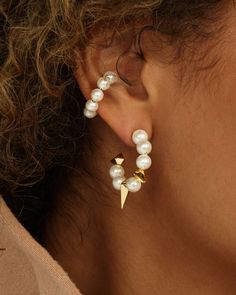 Mother Nature, upping your style game since forever. An ear cuff is a one and done way to make any look cooler. With its delicate pearl detail, the Life’s a Ball Pearl Ear Cuff cuff is the perfect way to achieve a unique stacked look with no piercing required. DETAILS: Single Earcuff SKU: E7033 MATERIALS:﻿ 18k Gold Pla Pearl Ear Cuff, Melinda Maria Jewelry, Melinda Maria, One And Done, Gold Ear Cuff, Silver Ear Cuff, College Outfits, Bridal Accessories, Quality Jewelry