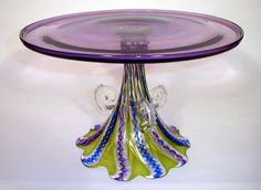 a purple glass plate with an angel on it