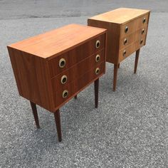 two wooden drawers sitting on top of each other