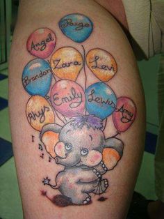 an elephant with balloons tattoo on his arm