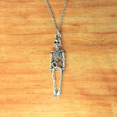 ♥ Skeleton Necklace Silver Skeleton Charm Necklace Skeleton Gift Halloween Charms Christmas Gift Personalized Necklace ♥ This is a beautiful skeleton charm with ♥ You will receive 1 necklace ♥ Skeleton charm 39x9x3 mm ♥ Stainless steel chain 18 inches ♥ We strive for next day shipping, but we do not ship on Saturdays, Sundays, and Holidays. It may sometimes take a bit longer when we have unusually large volume of orders. Thank you for your patience! ♥♥ For more details on shipping guideline and Halloween Skull Jewelry For Jewelry Making, Halloween Jewelry Making Skull Beads, Halloween Skull-shaped Jewelry For Jewelry Making, Halloween Skull-shaped Jewelry Making Supplies, Halloween Themed Pendant Necklace With Charms, Spooky Skull Jewelry For Gifts, Halloween Skull Jewelry In Bone Color, Halloween Skull Shaped Bone Jewelry, Skull-shaped Bone Jewelry For Gifts