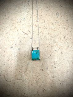 This is a simple but cute little pendant. It is perfect as an everyday accessory. Made of .925 sterling silver with a beautiful turquoise stone and set on an 18" chain. Turquoise Rectangular Pendant Necklace In Sterling Silver, Turquoise Pendant Necklace In Sterling Silver, Turquoise Sterling Silver Rectangular Pendant Necklace, Turquoise Sterling Silver Necklace With Rectangular Pendant, Turquoise Necklace With Large Sterling Silver Stone, Turquoise Sterling Silver Necklace With Large Stone, Sterling Silver Turquoise Necklaces Stamped 925, Turquoise Sterling Silver Necklaces Stamped 925, Turquoise Sterling Silver Necklace Stamped 925