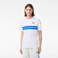 Go for maximum Lacoste style in this heavy jersey tee. Inspired by styles from our archives, featuring an XL print for a vintage feel. Featuring a modern, comfortable cut with dropped shoulders. White Jersey T-shirt For Summer, Sporty Relaxed Fit Cotton Jersey T-shirt, White Jersey T-shirt With Logo Print, Sporty Cotton Jersey T-shirt With Logo Print, White Relaxed Fit T-shirt With Three Stripes, Graphic Print Jersey Top With Crew Neck, White Graphic Print Jersey Tops, Graphic Tee With Crew Neck In Jersey, Graphic Tee With Crew Neck In Jersey Material