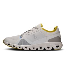 the on cloud running shoe in white with yellow detailing and grey uppersole, side view