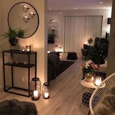 a living room filled with furniture and candles