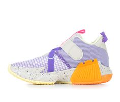 a purple and orange sneaker with yellow soles on the bottom, in front of a white background