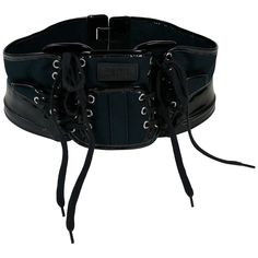 JEAN PAUL GAULTIER collector boxing corset belt. This belt features : - Dark navy blue canvas panels embellished with black patent PVC details. - Black laces on front. - Silver toned eyelets. - Rubber JEAN PAUL GAULTIER patch on the frontal panel. - Velcro fastening on the back. Indicated sizes : US 12 / UK 14 / FR 80. Made in France. Indicative measurements : adjustable length from approx. 78 cm (30.71 inches) to approx. 79 cm (31.10 inches) / max. width approx. 12 cm (4.72 inches). BELT CONDIT Black Leather Gothic Corset Belt, Black Leather Corset Belt With Belt Loops, Luxury Black Corset Belt With Belt Loops, Black Luxury Corset Belt With Belt Included, Luxury Black Corset Belt With Belt Included, Punk Style Black Corset Belt With Included Belt, Black Leather Corset Belt With Belt Detail, Black Gothic Corset Belt With Belt Loops, Black Punk Corset Belt With Belt Loops