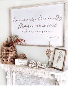 a white fireplace with a sign above it