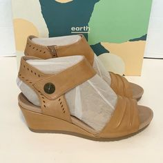 Earth Women's Attalea Barbados Wedge Sandal Sun Tan Size 10 Brand New. Brand New With Box. Leather Upper. Leather Sole. Heel Measures Approximately 2.5 Inches" Comfortable Wedge Sandals With Ortholite Insole, Wedge Sandals With Arch Support And Medium Width, Wedge Sandals With Arch Support And Round Toe, Spring Wedge Sandals With Ortholite Insole, Leather Wedge Sandals With Ortholite Insole And Round Toe, Closed Toed Shoes, Mary Jane Wedge Shoes, Tan Wedge Sandals, Brown Leather Wedges