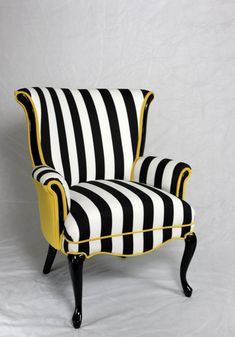 a black and white striped chair with yellow trim