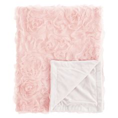 a pink and white blanket with roses on it