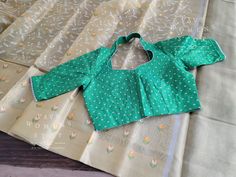 Blouse stitched - Yes Blouse Opening - Back Sleeves Length - Elbow Padded - No Blouse size - 38 with inner margins expandable upto 44 For Blouse Size 36 alteration can be done on request. Fall/pico - Yes done All over embroidery work comes only for Pallu part. Green Cutdana Blouse For Summer, Green Summer Blouse With Cutdana Details, Green Long Sleeve Blouse With Self Design, Green Cotton Blouse With Cutdana Detail, Green Cotton Blouse With Cutdana, Green Cotton Cutdana Blouse, Green Long Sleeve Self-design Blouse, Green Padded Cotton Blouse, Green Fitted Cotton Blouse Piece