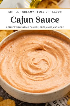 a bowl of cajun sauce with chips on the side and text overlay that reads simple creamy full of flavor