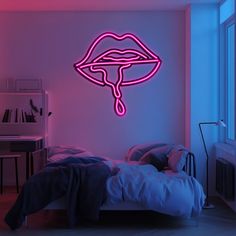 a bed room with a lit up neon sign on the wall