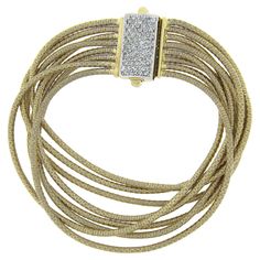 Here we have a beautiful multi strand gold bracelet crafted in solid 14k yellow gold. It feature very fine and well done coiled gold wire that wraps around each strand and offers soft silky feel around the wrist. The clasp is fully encrusted with approximately 3/4 carats of round cut diamonds, adding a wonderful touch of brilliance to this statement piece. A truly outstanding bracelet that remains in excellent condition and is ready to wear and impress. Enjoy :) --Stone(s):-- (77) Natural Genuin Gold Armband, Bracelet Crafts, Gold Wire, G H, Multi Strand, Round Cut Diamond, Link Bracelets, Chain Bracelet, Round Cut