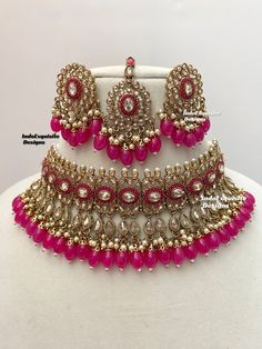 Antique Gold Polki Necklace Set comes with Stud earrings and tikka / Indian Jewelry/ High Quality Kundan and Polki Jewelry/ Bollywood Jewelry/Wedding Jewelry/Magenta hot pink color  All items are shipped from Brampton, Ontario, Canada. If you need your item by a certain day, please reach out to us for express delivery option before placing the order so that we can update the shipping for you. Standard shipping/delivery timeline Below are the delivery timeline estimates once the order ia shipped ---> USA delivery timeline * 3-5 business days to major urban centers in USA. It may take 1-2 days extra to remote locations ---> Canada delivery timeline  * 2-3 business days - GTA  & Montreal  * 2-4  business days - Rest of Ontario/Quebec * 3-6 business days-  Rest of Canada    ---> Europe/Middle Luxury Multicolor Jewelry For Diwali, Pink Indian Jewelry Set, Pink Indian Jewelry Flowers, Hot Pink Necklace Jewelry, Cheap Meenakari Jewelry For Festive Occasions, Luxury Kundan Necklace With Meenakari And Ruby, Pink Jewelry Set Indian, Luxury Multicolor Bollywood Earrings, Party Necklaces With Zari Work For Diwali