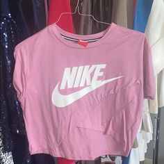 Never Worn Nike Pink Women’s Shirt. Size Medium. Nike Pink Top With Logo Print, Nike Tops With Logo Print For Spring, Nike Spring Short Sleeve Tops, Nike Trendy Top For Spring, Nike Short Sleeve Tops For Spring, Trendy Pink Nike Tops, Nike Sporty Shirt For Spring, Sporty Logo Print Shirt For Spring, Nike Sporty Spring Shirt