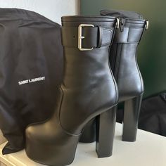 Truly Stunning Saint Laurent Platform Boots. Hit Mid-Calf With A 5.75” Stacked High Heel, 2.5” Wrapped Platform - Feels Like A 3.25” Heel. They’re Surprisingly Comfortable Thanks To The Stability Offered By How High It Goes. These Are Brand New, Never Worn And Come With The Saint Laurent Dust Bags (2). Fit True To Size. Size 36.5. Luxury Ankle Boots With 4-inch Heel, Platform Boots For Night Out, Elegant Leather Platform Boots With Buckle Closure, Chic High Heel Boots With Heel Loop, Luxury Platform Boots With Round Toe, Luxury High Heel Boots Medium Width, Leather Platform Boots With 4-inch Heel For Party, Luxury High Heel Boots Of Medium Width, Luxury High Heel Boots With Medium Width