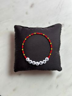 Awesome Charles Leclerc beaded friendhip bracelet for F1 fans! This bracelet is perfect if you want to show support for Charles Leclerc and Ferrari. The bracelet is made of strong elastic string, small glass beads and white letter beads. Feel free to message us if you have questions or need variations. Our bracelets ship from Norway and they are sent as letters without tracking. Any additional tax that may apply is the responsibility of the customer. If you are unsure about possible taxes, conta Ferrari Friendship Bracelet, Charles Leclerc Bracelet, Ferrari Bracelet, Forza Ferrari, F1 Fans, Charles Leclerc, Beaded Bracelets Diy, Letter Beads, White Letters