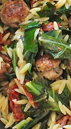 pasta with meatballs and spinach in a bowl