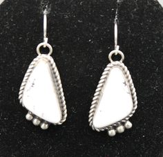 White Buffalo and Sterling Silver French Hook Earrings measure 1" long with a total drop length of 1 3/8" and is 1/2" wide White Sterling Silver Long Drop Jewelry, Formal White Teardrop Earrings With Ear Wire, White Long Drop Ear Wire Jewelry, White Long Drop Teardrop Earrings With Ear Wire, White Long Drop Earrings With Ear Wire, Classic White Teardrop Sterling Silver Earrings, White Long Drop Teardrop Earrings, Classic White Sterling Silver Teardrop Earrings, Bohemian White Nickel-free Earrings