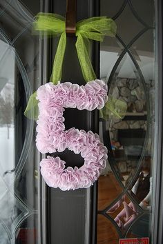 the letter s is made out of pink flowers