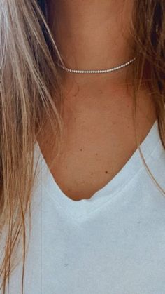 "2.2MM Cubic Zirconia Tennis Necklace | 14K Gold Filled | Diamond Tennis Choker Necklace | Bridal Jewelry | Dainty Minimalist Necklace ♦ Materials: 14K Gold filled ♦ Available colors: Gold  ♦ Necklace measurements: 14\" + 2\" extender, 15\", 15.5\" + 2\" extender, 2.2 mm wide The necklace shown on the video is the 15.5\" option, if you choose the 14\" + 2\" extender 15.5\" + 2\" extender the clasp will be a lobster clasp and it will include an extender of 2\" -------------------------------------------------------------------------------------------------- PRODUCTION TIMES Order processing time varies between 1-2 business days, we work on our pieces daily All orders placed on Sunday, or on a national holiday will begin processing the following business day HOW TO FIND YOUR PERFECT FIT Neck Dainty White Cubic Zirconia Necklaces, White Dainty Cubic Zirconia Necklace, Dainty White Cubic Zirconia Necklace, Minimalist Tennis Necklace With Vvs Clarity, White Diamond Jewelry With Delicate Chain, White Dainty Necklace With Diamond Accents, Dainty White Necklace With Diamond Accents, Everyday White Cubic Zirconia Jewelry, Dainty White Diamond Jewelry