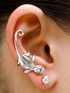 a close up of a person with an ear piercing