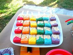 there is a cake made to look like marshmallows on a tray with other treats