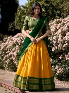 Introducing our stunning great yellow zari weaving kanchipuram silk function wear lehenga choli! This exquisite ensemble features a yellow color Kanchipuram silk lehenga with intricate zari weaving work, paired with a matching green color Kanchipuram silk choli also adorned with zari weaving work. Completing the look is a green color georgette plain dupatta with intricate lace borderwork.
The lehenga is beautifully stitched up to 42 inches in length, with a 3.70-meter flair, while the choli come Kanchipuram Lehenga, South Indian Culture, Fashion Lehenga, Zip Stitching, Lehenga Choli Designs, Lehenga Crop Top, Half Saree Lehenga, Lehenga Choli Wedding, Lehenga Fabric