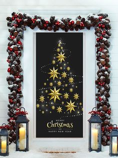 a christmas tree with gold stars is displayed in front of two lanterns and a black background