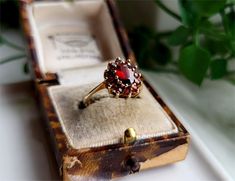 VINTAGE STATEMENT RING A Gorgeous Garnet Cluster set in a Superb Solid 9ct Gold Setting Middle Garnet is 8x6mm Outers are 2mm Size UK O Size USA 7 RESIZING AVAILABLE Vintage Oval Cluster Ring With Gemstone, Vintage Round Ruby Ring, Vintage Gemstone Cluster Ring For Anniversary, Antique Oval Cluster Ring As Gift, Antique Oval Cluster Ring For Gift, Vintage Red Cluster Ring For Wedding, Vintage Ruby Ring Gift, Vintage Cluster Ring As Gift, Vintage Cluster Ring Gift