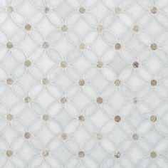 a white rug with circles and dots on it