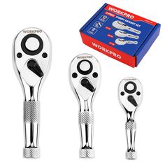 three different types of wrenches in front of a box