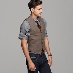 J. Crew Cotton/Tweed Vest.    It may fall in and out of 'trends" for fashion but if it's always coming around, getting one and holding onto it for a while isn't a bad idea.  Even if certain Fox T.V. singing teachers are running it into the ground. Mens Vest Fashion, Tweed Vest, Vest Outfit, Mens Fashion Smart, Vest And Tie, Brown Tweed, Mens Fashion Jeans, Mens Style Guide, Jean Vest