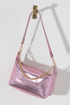 Make a statement this summer with Shiraleah's Maddie Shoulder Bag. Made from metallic PU, this shiny handbag is sure to turn heads. Add some versatility to your style by wearing with the detachable single shoulder strap or with the chic chain handle. Pair with other Shiraleah items to complete your look! Party Shoulder Bag With Zipper And Double Handle, Chic Silver Shoulder Bag With Detachable Strap, Trendy Silver Shoulder Bag With Detachable Handle, Chic Metallic Shoulder Bag For Party, Chic Silver Bag For Summer, Chic Silver Bags For Summer, Trendy Silver Evening Bag With Removable Pouch, Chic Metallic Shoulder Bag For Evening, Gold Shoulder Bag With Detachable Strap For Fashion